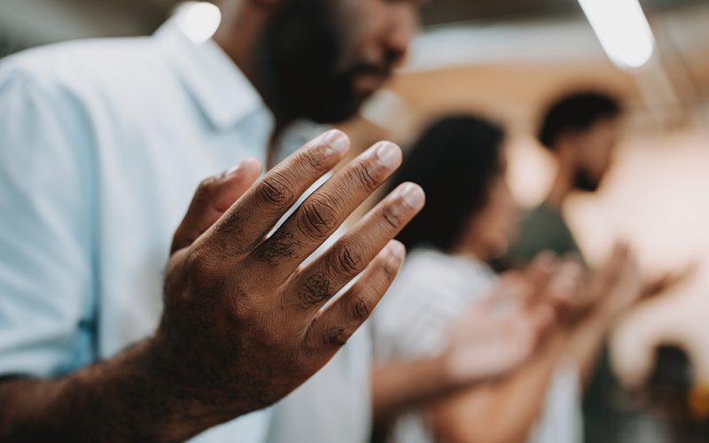 Group of people praying for mental support