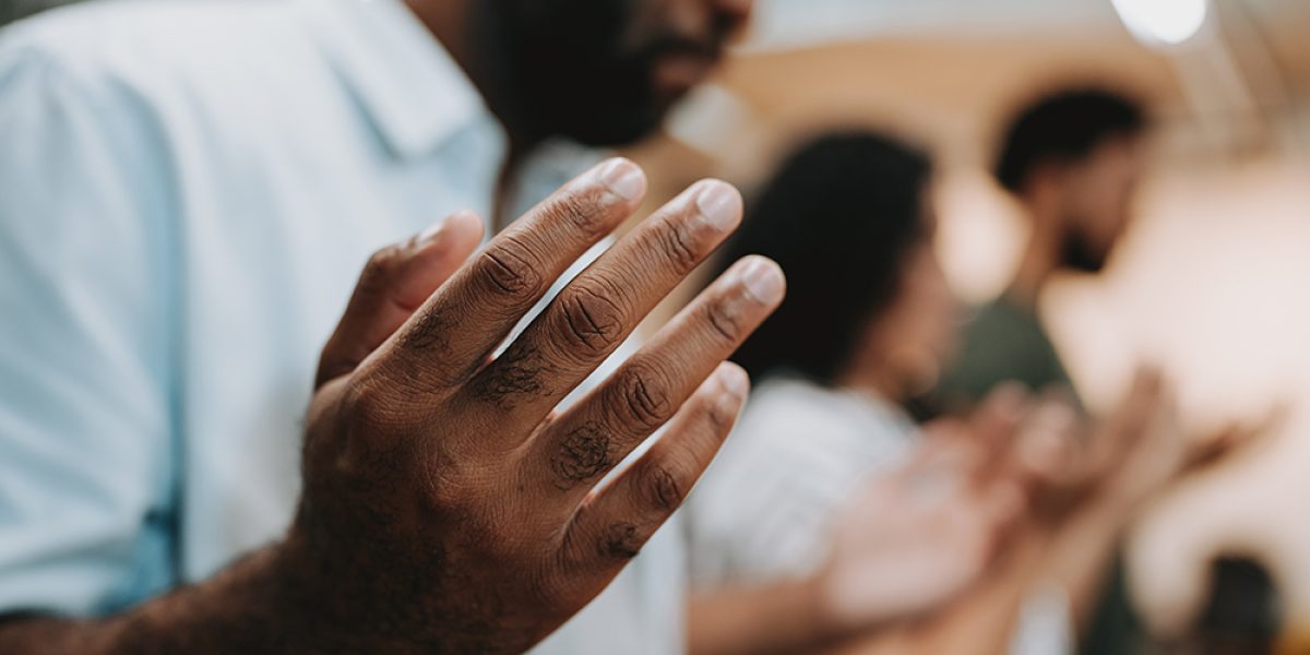 Group of people praying for mental support